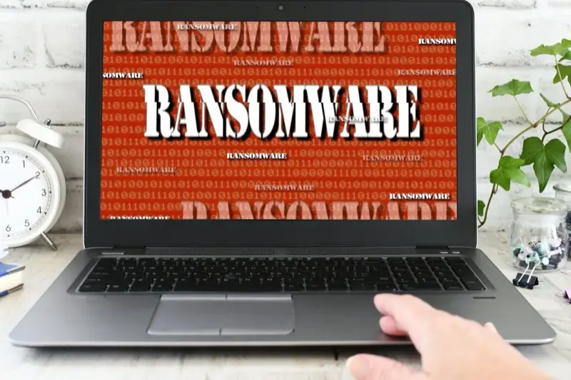Ransomware warning message on computer screen threatening business data