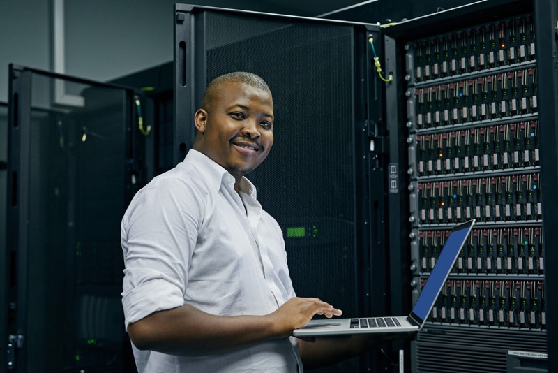 IT technician working on web hosting server in data centre